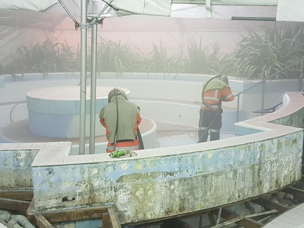 Pool being sandplasted prior to fibreglass lining