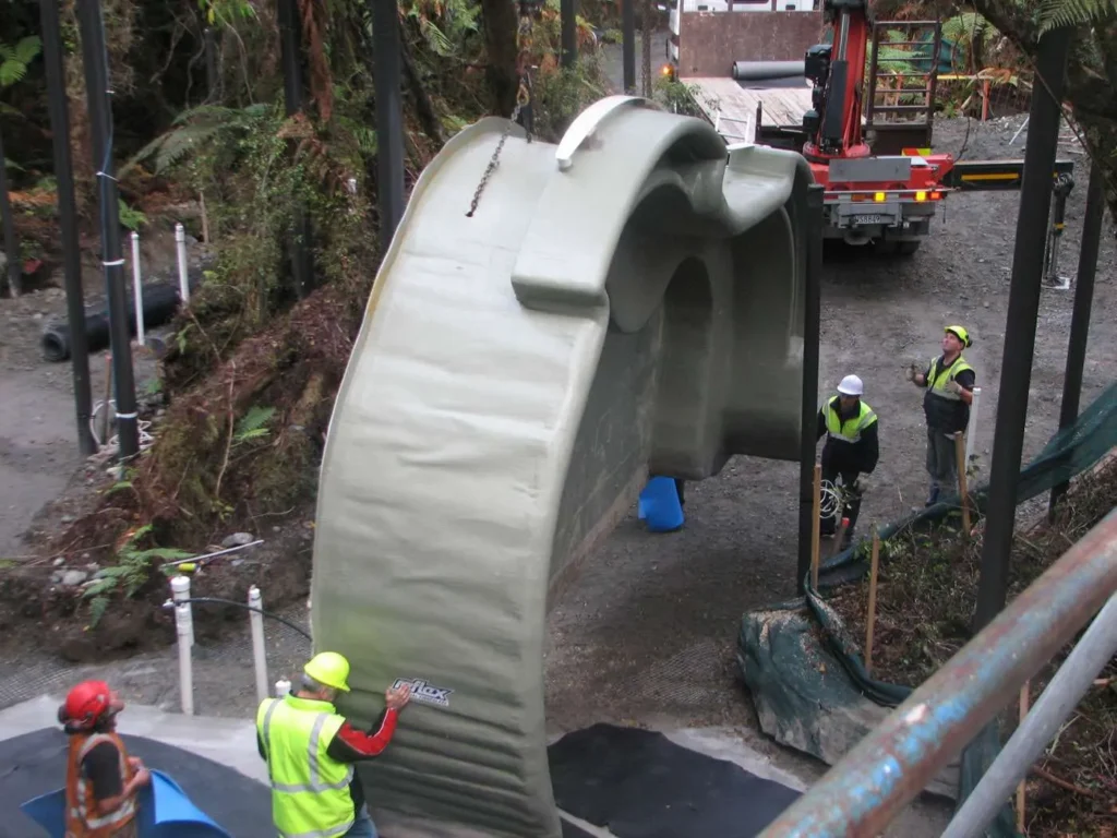 Navigating the natural surroundings, including native rain forst, where the pools will be installed