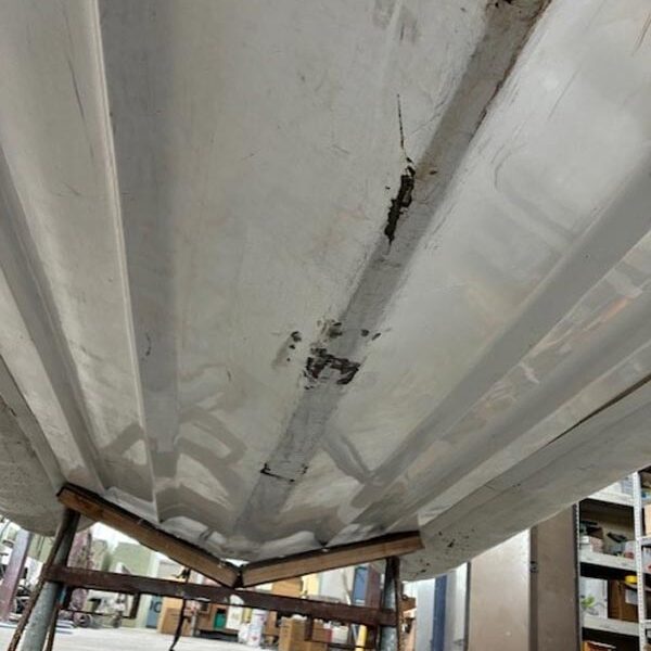 A boat hull before repair